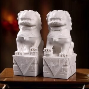 A PAIR OF GUARDIAN LIONS SCULPTURE