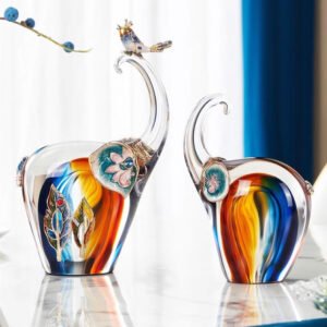 A PAIR OF GLAZE ELEPHANTS INSPIRED FROM THE WIZARD OF OZ