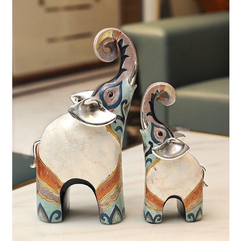 A PAIR OF LUXUTY SHELL ELEPHANT ORNAMENTS
