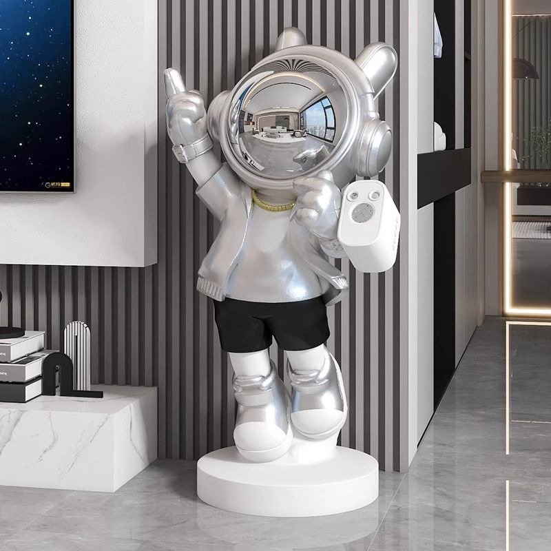 STYLIZED ASTRONAUT SCULPTURE WITH STARRY SKY PROJECTION